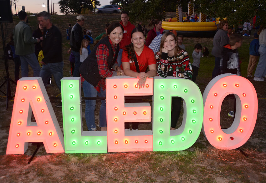 Christina Bailey, Elizabeth Bailey and Rugh Lindly pose for a group picture at the ALEDO display.