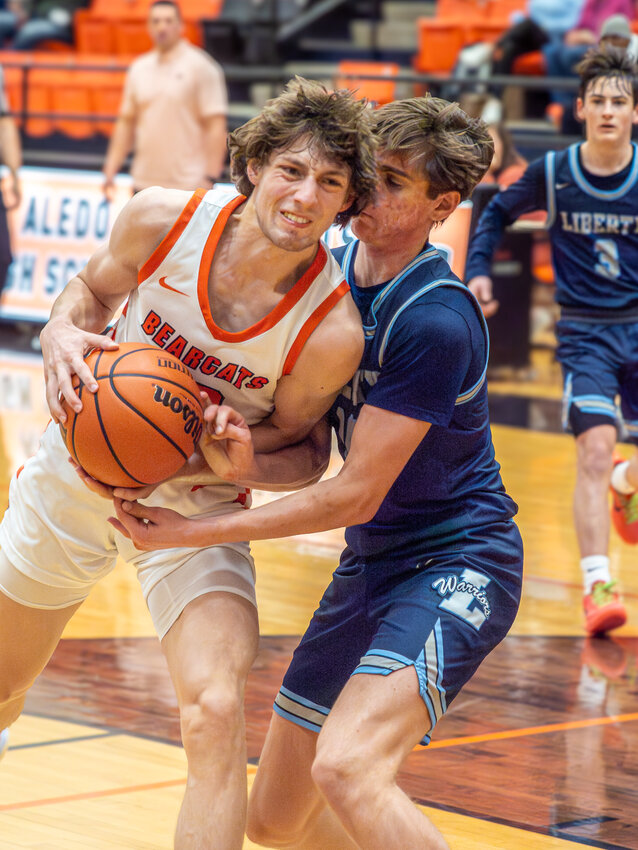 Kaden LoBaugh works hard to get to the basket against a Liberty Christian defender during the opening round of the Moritz Classic Tournament on Thursday, Dec. 7.