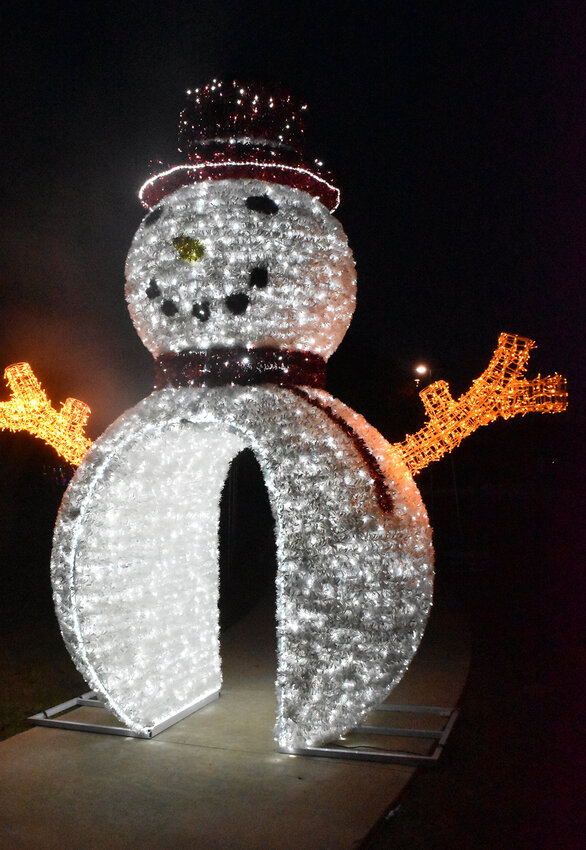 A giant walk-through snowman is one of the experiences on a walk through Gene Voyles Park during the Christmas season.