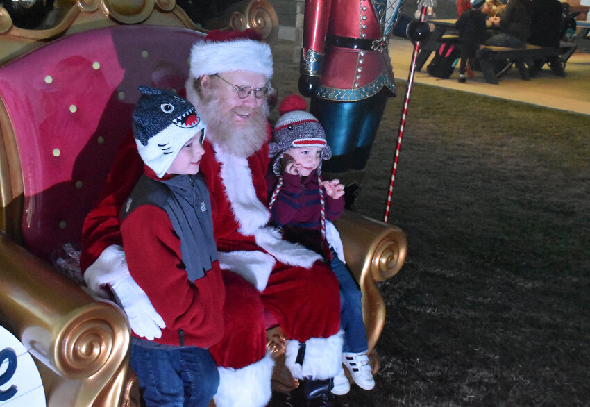 Cameron and Graham Noyes visit with Santa.