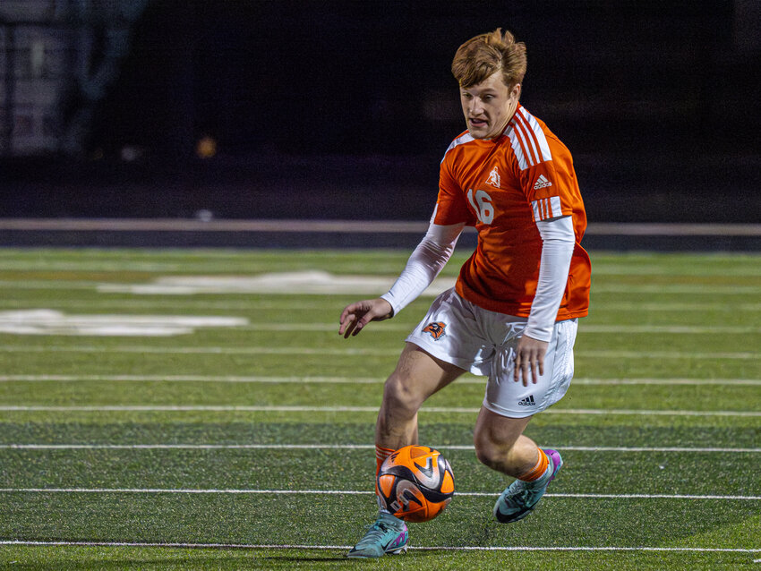 Harrison Kear dribbles down the field during Aledo's 3-1 win over Chisholm Trail in the opening round of the Moritz Kia Tournament on Thursday, Jan. 11.
