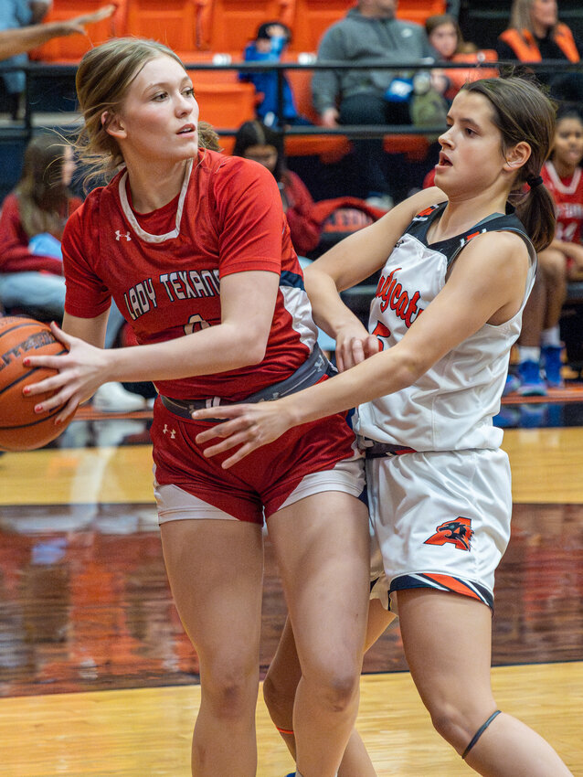 Elizabeth Griffin plays pressure defense against Northwest as the Ladycat defense runs a press early in the game on Friday, Jan. 19.