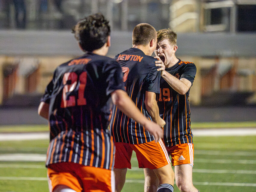 Robert Sloan celebrates with teammate Trent Newton following Newton's goal-scoring header on a free kick during the second half of Aledo's match against Saginaw on Friday, Feb. 2.