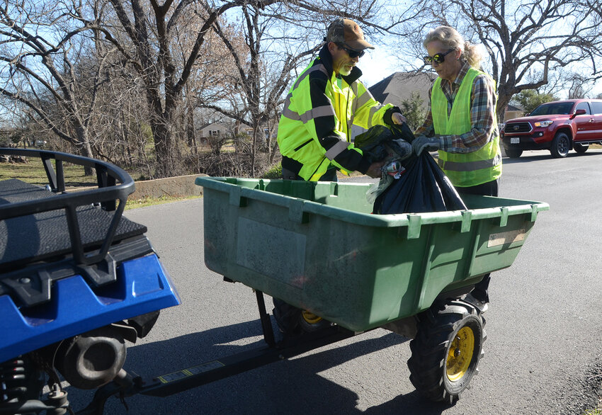 David and Anne Nelson used their own four wheeler and wagon to pick up trash in the Deer Creek Area when Annetta residents joined together to pick up trash on Saturday, Feb. 24. The town’s residents collected 33 bags in total.