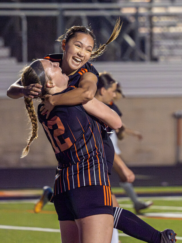 Hailey Vandiver celebrates with teammate Katie Cox after Cox scored the go-ahead goal for the Ladycats.