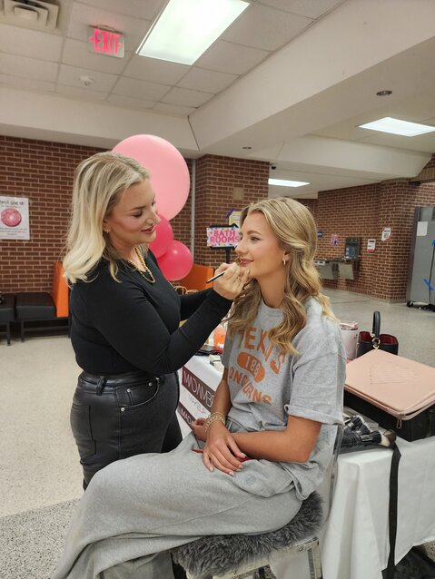 Aledo High School senior Daniella Tregelas gets made up by Madison King, owner of Madam Bradley Makeup Artistry, before the Spring Fling fashion show March 2.