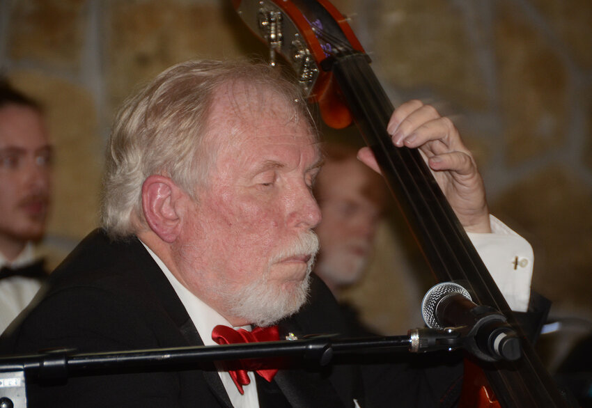 Bass player Bob Lewis of Aledo sings “What a Wonderful World” with the Joshua Experience Orchestra.