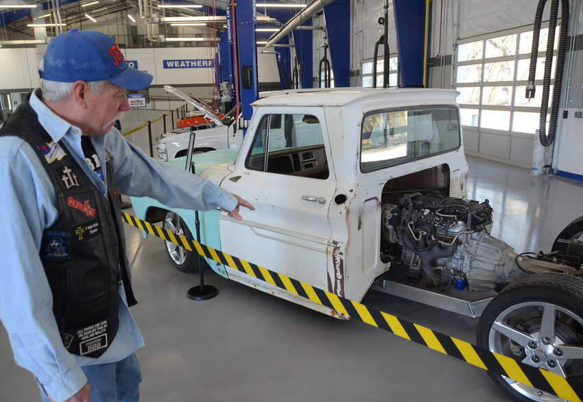 John Slater looks at a 1965 Chevy truck with a 2001 Corvette mid-mounted engine in the GRIT Auto Learning Lab. The life-long mechanic and car collector was impressed with the massive new building at the Weatherford Ninth Grade Campus.