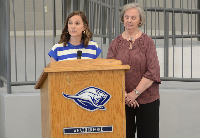 Roger Grizzard’s daughter Holly Grizzard, left, and widow Jeanine Grizzard spoke about Roger’s commitment to the students of the WISD.