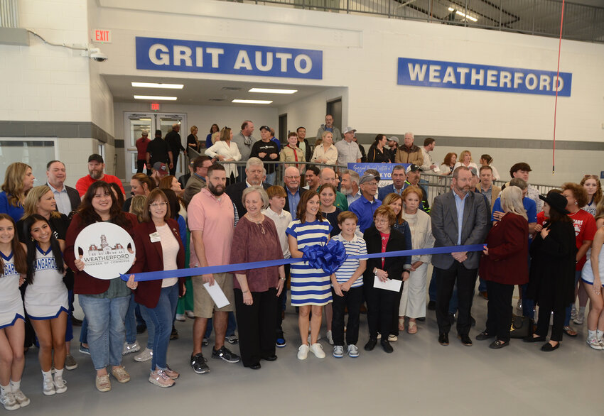 3454.Grizzard family members, school board members, WISD staff, instructors, and friends gather to cut the ribbon for the new GRIT Auto Learning Lab.
