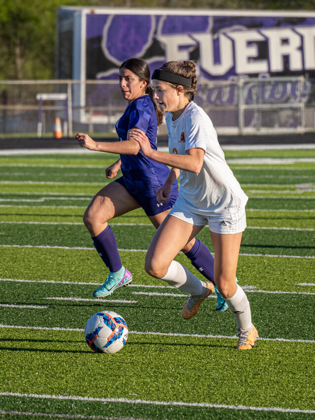 Emery Thompson breaks away from her marker during the first half of bi-district playoff match against Everman on Tuesday, March 26. Thompson scored the first goal for the Ladycats with just eight seconds left in the first half.