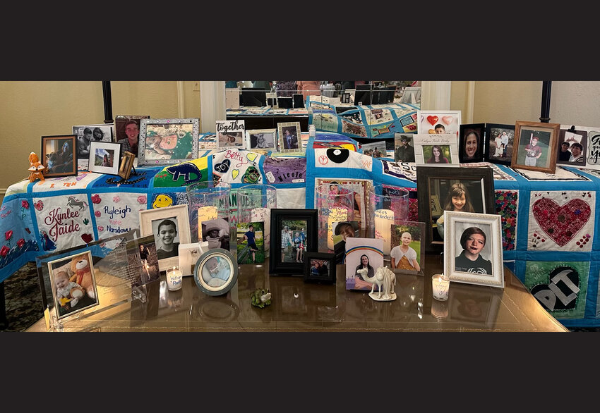 Photos and memorabilia help grieving parents remember lost children, part of the process by the non-profit A Memory Grows.