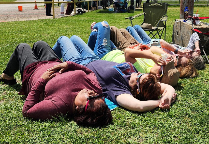 (From left) Alaina Tenseth, Edith Bagniewski, Cindy Bautch, Becky Tenseth and Herminia Mack relax and prepare to watch the eclipse at Total Eclipse of the Park.