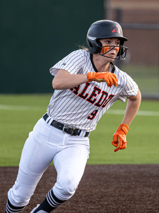 Addie Perry goes first-to-third on a sacrifice bunt by Delaney Rosser in the first inning of the Ladycats' 15-1 rout over Brewer on Friday, April 12.