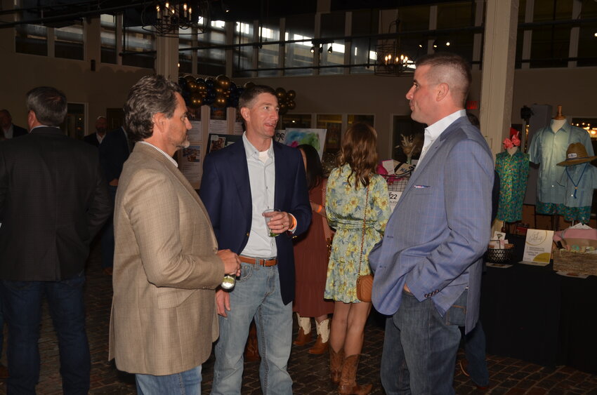 Jerrod Kerr, Brooks Stevens and Ryan Pipkin visit before the banquet.