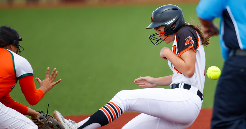 Aledo sophomore Kyleigh Pawlak (14) reaches second base ahead of the throw during the Class 5A state softball semifinal between Aledo and Harlingen South, on May 31, 2024 in Georgetown. Harlingen South won, 1-0.