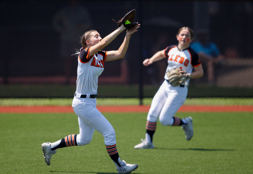 Aledo left fielder Maddy Flora (11) catches a fly ball for an out during the Class 5A state softball semifinal between Aledo and Harlingen South, on May 31, 2024 in Georgetown. Harlingen South won, 1-0.