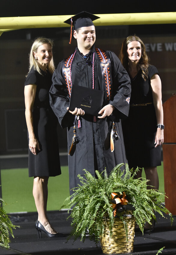Hunter Gregory poses for a photo with Aledo ISD Superintendent Dr. Susan Bohn and AHS Principal Angela Tims.