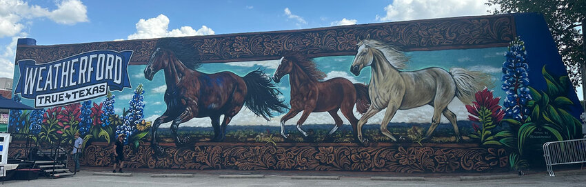 The “True Texas” mural that Calina Mishay created for the city of Weatherford. is a focal point for the new road construction and improvements.