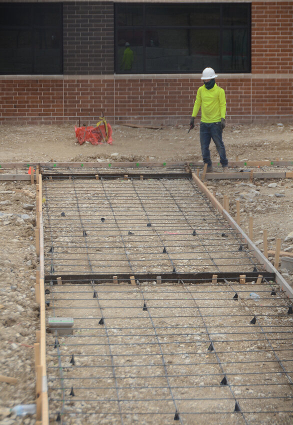 Sidewalks span between two wings of McKinney Elementary School's west classrooms.