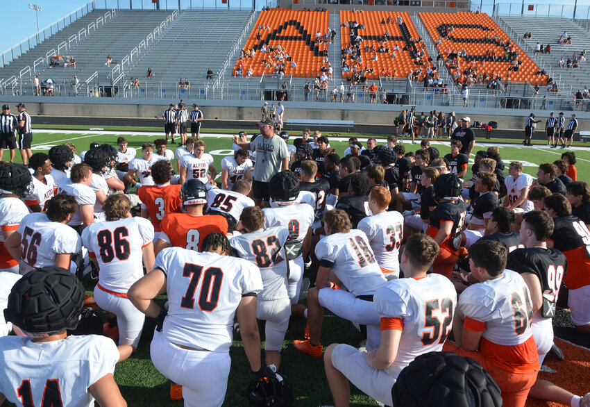 Aledo head football coach Robby Jones addresses players during an intrasquad scrimmage on Aug. 17.