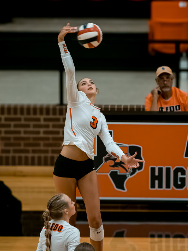 Outside hitter, Alyssa Todd soars through the air for a spike during the second set of the Ladycat varsity volleyball match against Midlothian on Tuesday, Aug. 27. Todd racked up 17 kills and 19 digs as Aledo fell to the visiting squad, three sets to two.