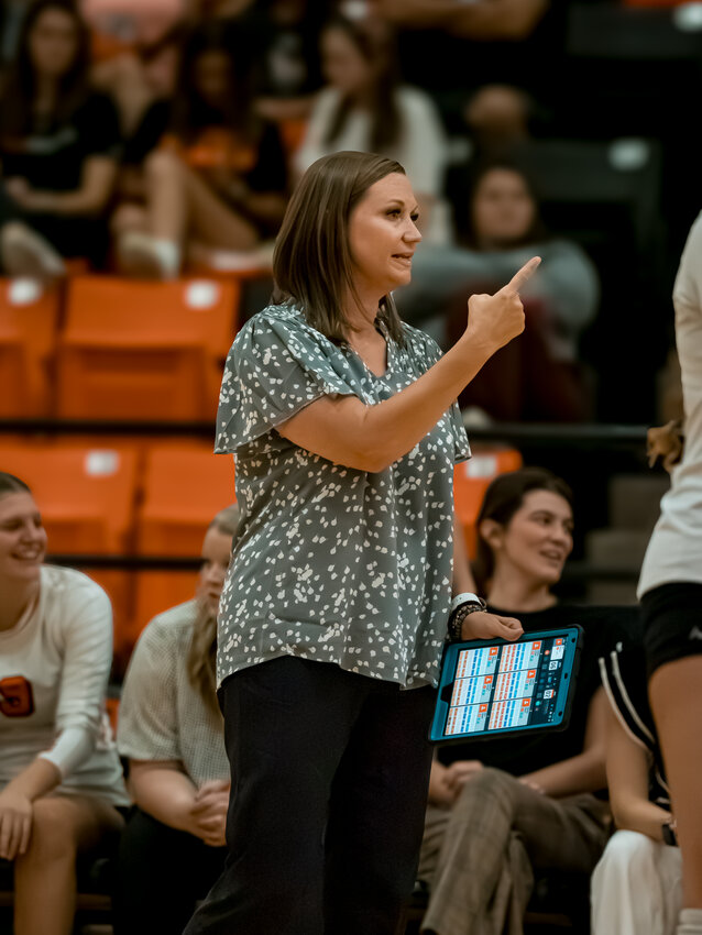 Ladycat volleyball head coach, Claire Gay gives instructions to her players during the latter stages of the home match against Midlothian on Tuesday, Aug. 27.