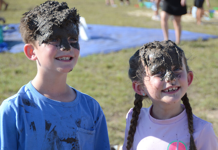 Second grade twins Maverick and Piper Johnson show what happens when you do the mud ball roll.