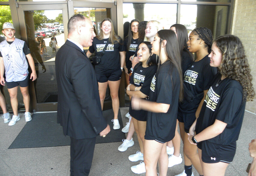 Dr. Tod Farmer speaks with athletes before the bond event.