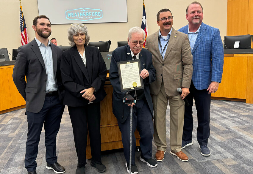 City Council Member Luke Williams (left) read a proclamation honoring John Hale for his service to veterans and the community. Also shown are council member Zack Smith and Mayor Paul Paschall at righjt.