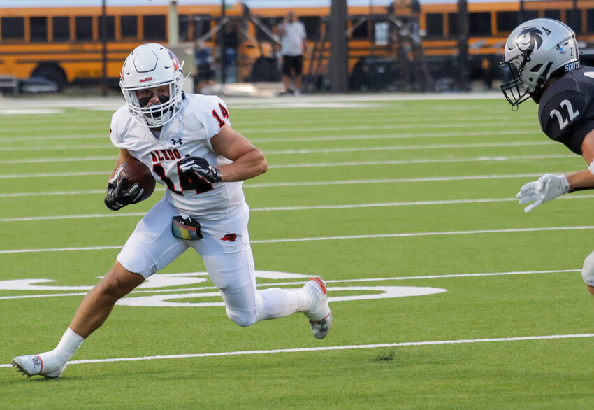 Blake Burdine makes a move against a Denton Guyer defender.