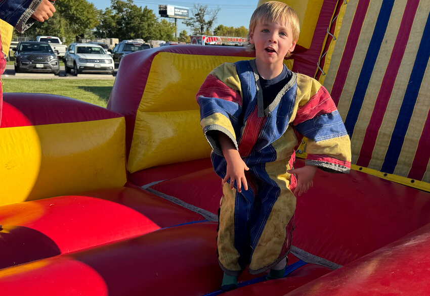 Ryder Miles tries out a velcro jump suit.