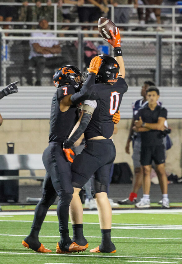 Owen Henderson (0) celebrates an interception against Denton Ryan.