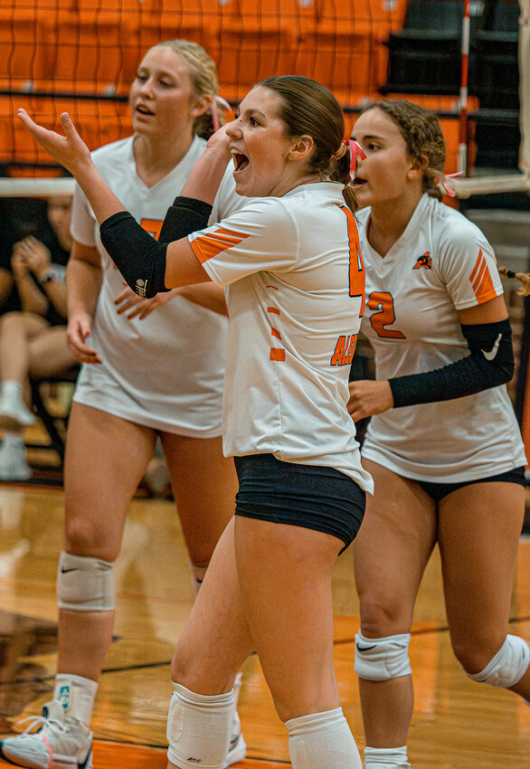 Logyn Denbow, Sophia Frank, and Ali Lobaugh celebrate a point during the Ladycats decisive win over Fossil Ridge on Tuesday, Oct. 22.