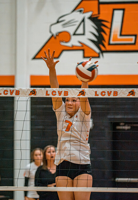 Kinley Elms comes up with a big block against Fossil Ridge as the Ladycats swept their final home match of the regular season on Tuesday, Oct. 22.