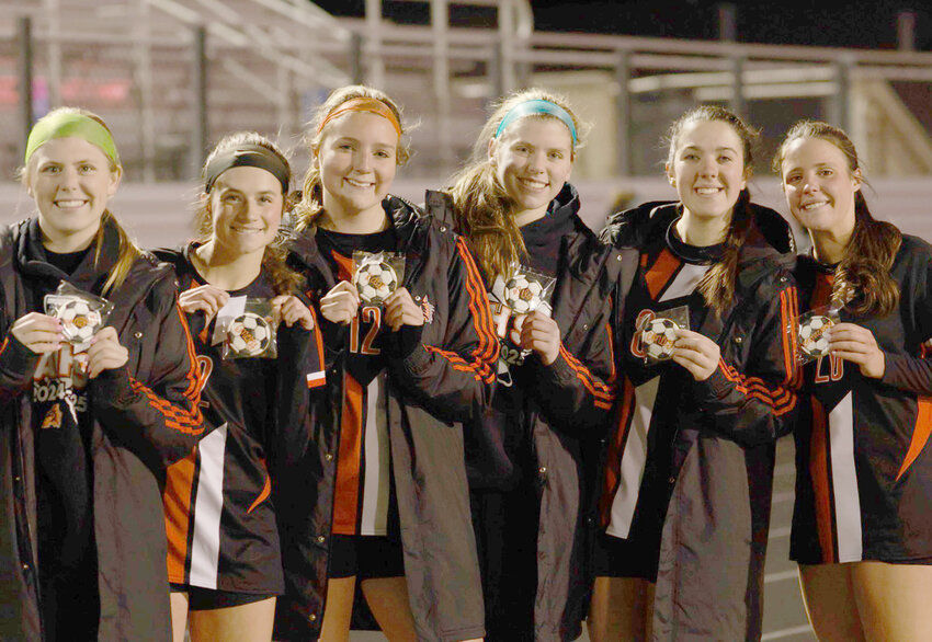 Soccer seniors (from left) Regan Tomlin, Emery Thompson, Katie Cox, Ava Fennell, Conley Hamilton, and Emma Grace Bolz