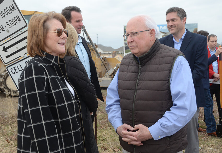 Luci Luemann of Vanguard Preparatory Schools visits with developer Fred Disney after a groundbreaking ceremony of the new preparatory campus.