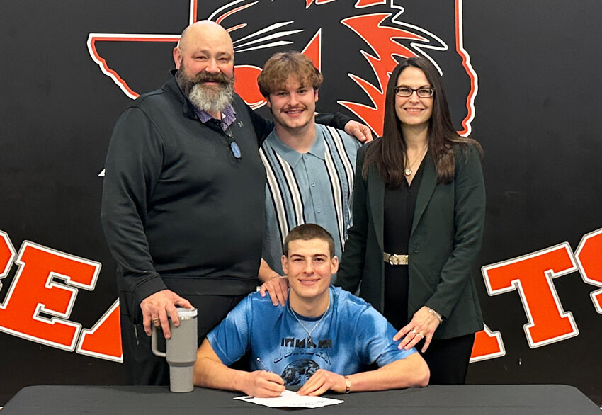 Brody Adams will play football at Kilgore College. He is shown with Rob and Amanda.
