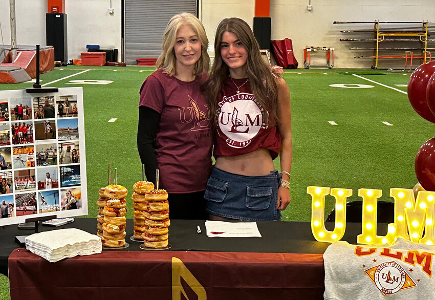 Maggie Kilburn will pole vault at the University of Louisiana Monroe. She is shown with Robin Kilburn.