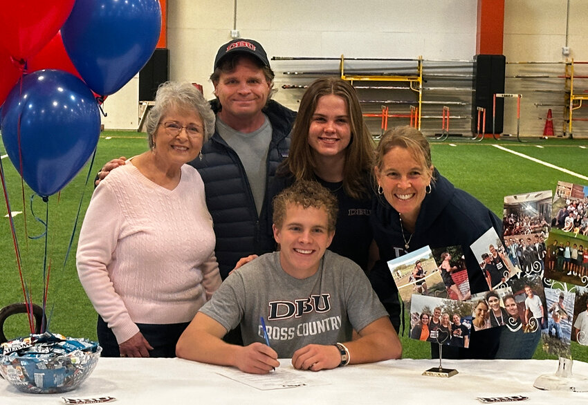 Luke Schabel will run cross country and track at Dallas Baptist University. He is shown with Tim, Carmen, Maggie and Dianne.