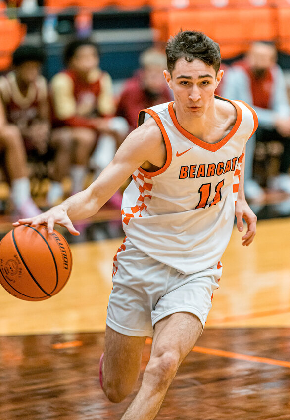 Enrique Pacheco drives into the lane on a fast break as the Bearcats cruised past Saginaw on Friday, Jan. 2.