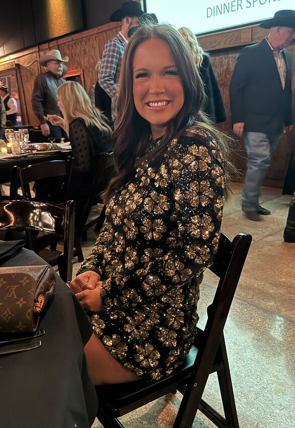 Kaylee Gayle prepares for dinner to begin.