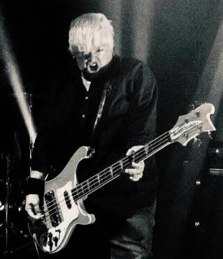 Umbarger is shown in rock music form playing the bass in The Toadies band.