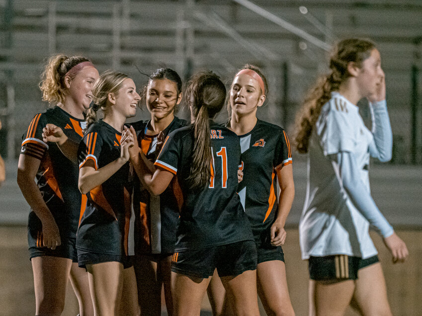 Allie Weimer and her teammates celebrate following her goal with 13 minutes left in the match against Fossil Ridge on Tuesday, Feb. 25.
