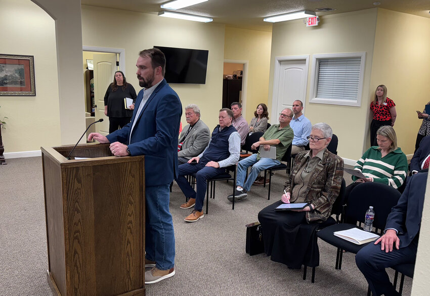 Jacob & Martin engineer Nik Kirk answers questions about the utility extension project that was later approved by the Willow Park City Council on March 11.