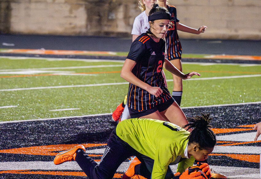 Saginaw goalkeeper covers the ball as Emery Thompson threatens to add another Ladycat goal during District 5-5A action in 2024.