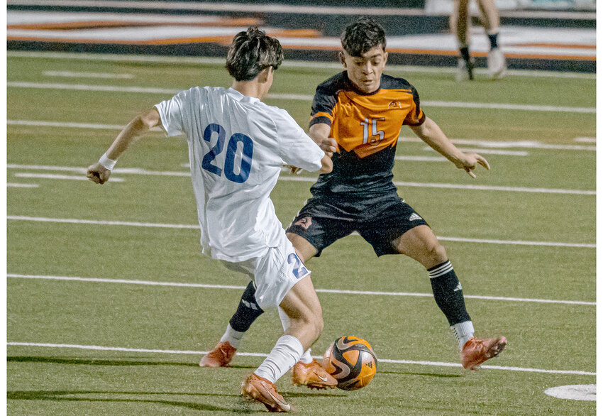 Evan Randriamahefa anticipates a Granbury player's next move during a home match on Feb. 7.