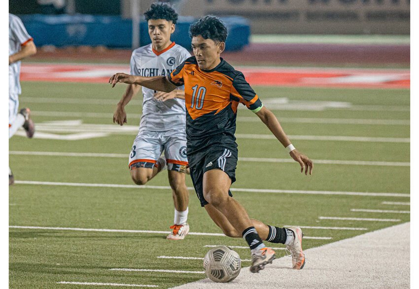 Austin Randriamahefa dribbles the ball down the field during the Bi-District match against Richland on Thursday, March 20.