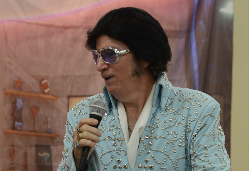 Elvis (Harvey McFadden) helps to get guests all shook up..