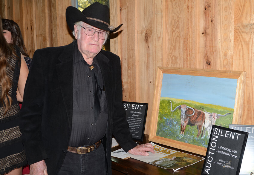 Parker County senior center member Gayle Hicks donated two works of art for the silent auction, including a piece featuring Longhorns.